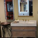 This bathroom vanity features a mirror and sink, perfect for your bathroom design.