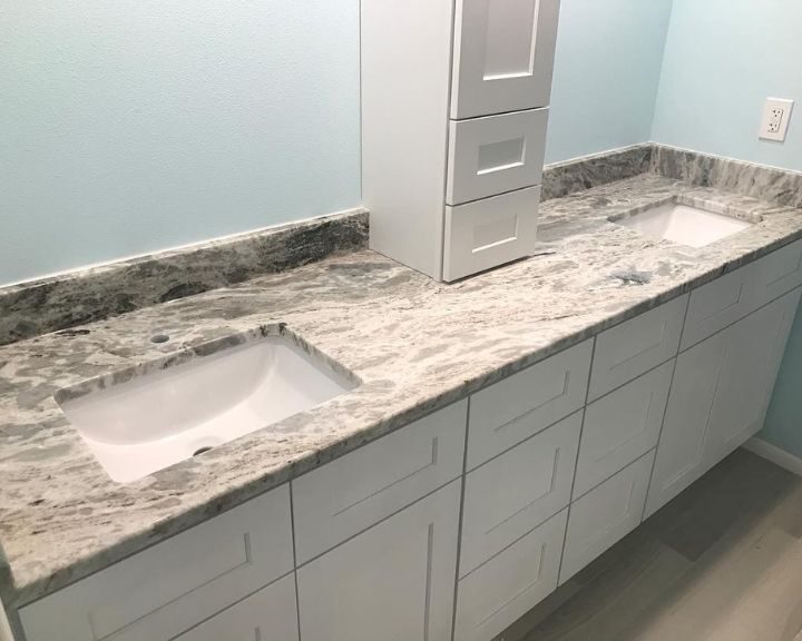 A bathroom remodel featuring two sinks and white countertop.