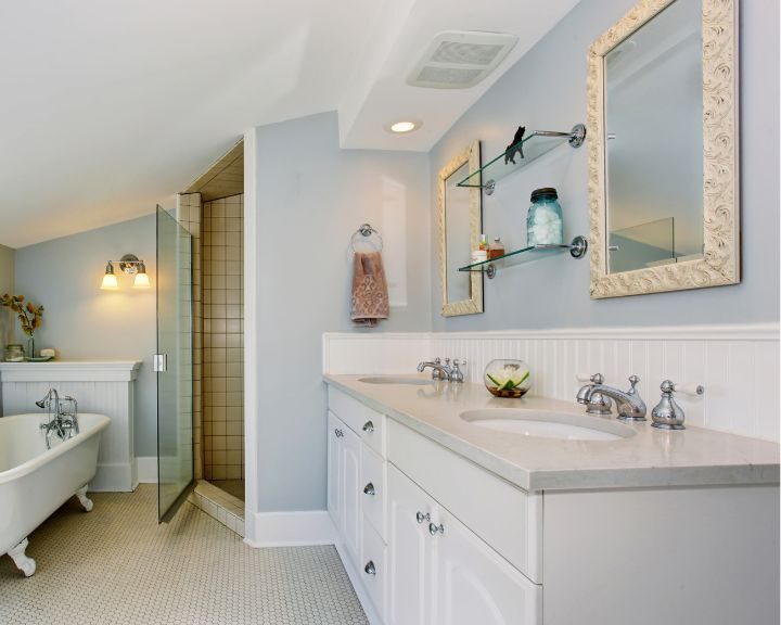 A white bathroom with a bathtub and sink, perfect for a bathroom remodel project.