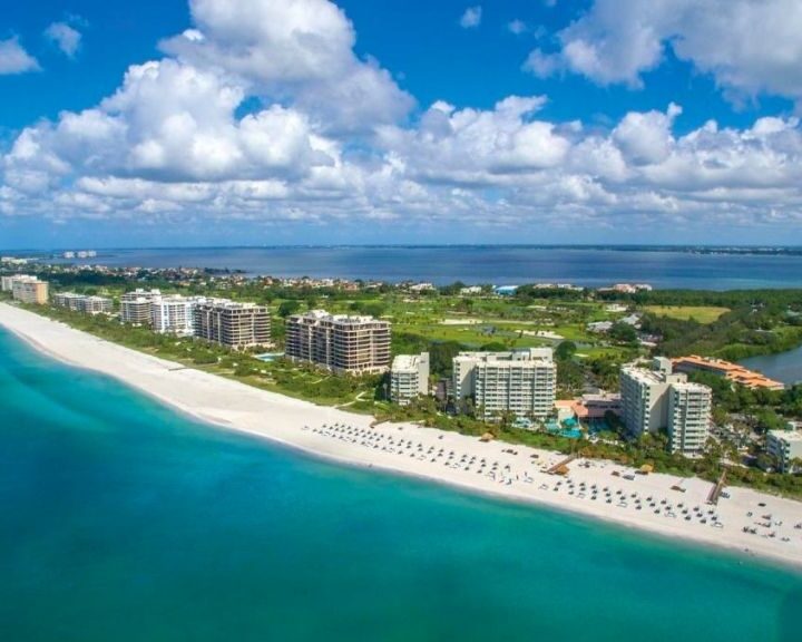 An aerial view of the beach and ocean, with a breathtaking scenery that showcases the beauty of nature.