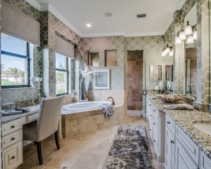 A large bathroom with two sinks and a tub. The bathroom is equipped with a spacious countertop and stylish cabinet for storage.