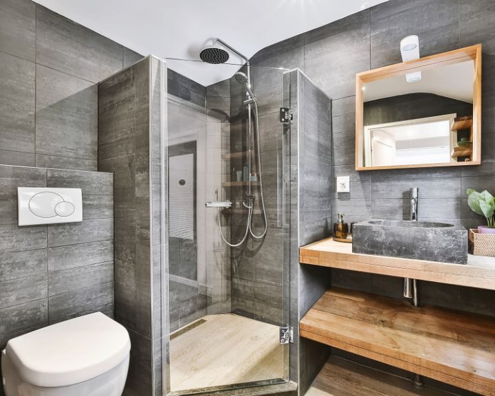 A modern bathroom with a glass shower stall.