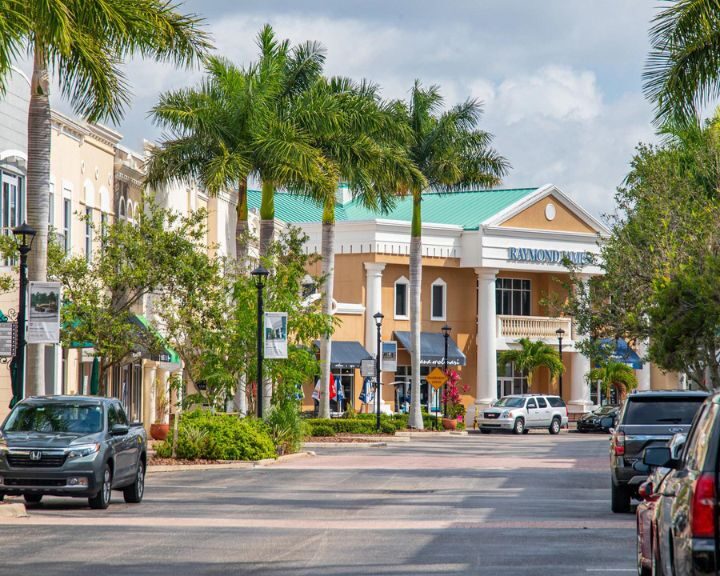 A street lined with parked cars.