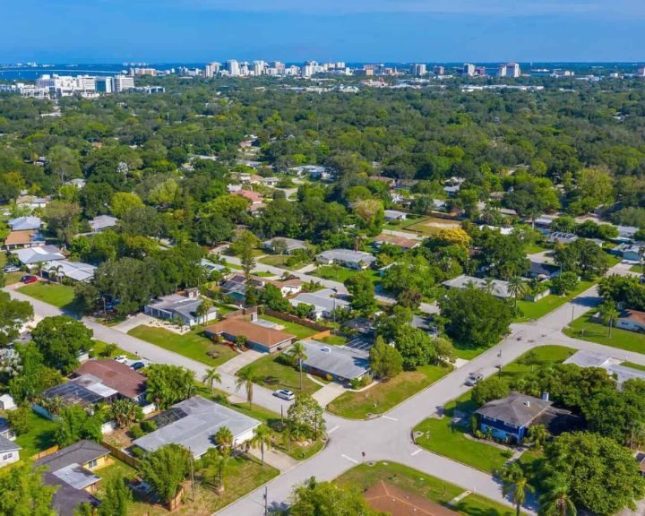 An aerial view of a neighborhood in Tampa, Florida with a scenic backdrop of exceptional bathroom designs and shower fixtures.
